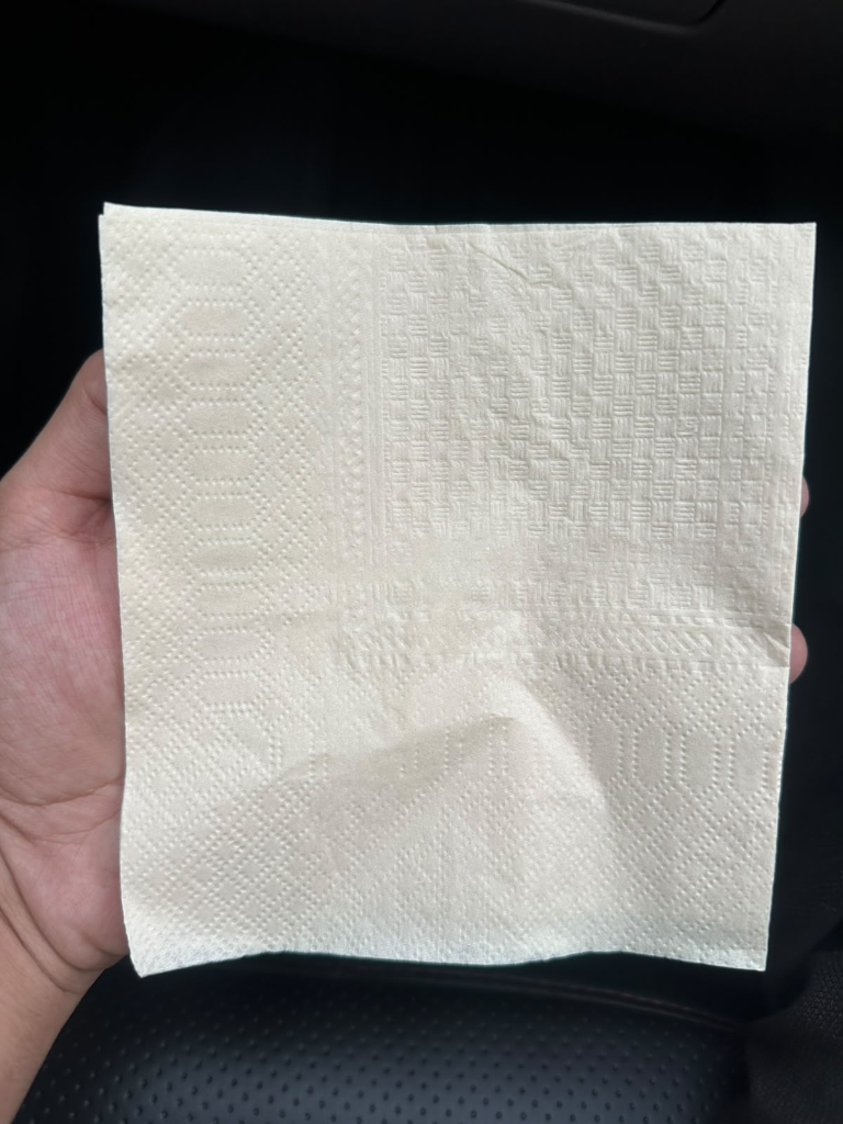 Original Unbleached Bamboo Napkin held in hand
